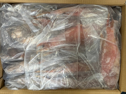 Frozen red grouper fish wrapped in clear plastic packaging inside a cardboard box.