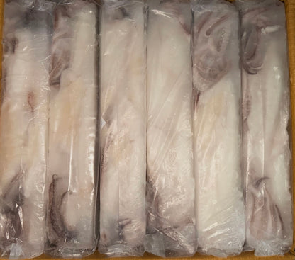 Packaged squid in clear plastic on a cardboard surface