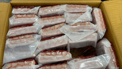 packaged crabsticks in a cardboard box.