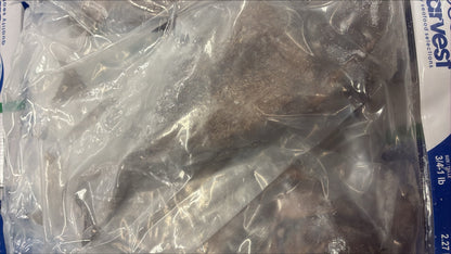 Frozen doctor fish in a clear plastic bag with a brand label on the side.